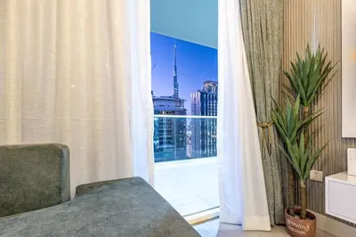 a room with a window with a view of a city at Elegant 2 Bedroom in Business Bay with Burj View in Dubai