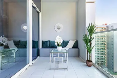 a living room with a couch and a table at Elegant 2 Bedroom in Business Bay with Burj View in Dubai
