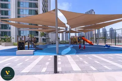 a playground with awning and slides in a building at Vogue Downtown Views II with Direct Access to Dubai Mall Via a Climate Controlled Bridge, One Bedroom Apartment with Balcony and City View in Dubai