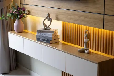 a shelf with books and a trophy on top at Burj Khalifa View 1 Bedroom Apartment With Balcony For Up To 4 Person in Dubai