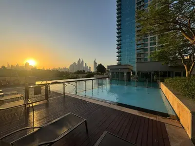 a swimming pool on the roof of a building at Luxe 1BR in Fairways East with Canal Views in Dubai