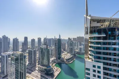 a view of a city with a river and buildings at Exclusive Marina Stay - Posh 3BR with Stunning Views in Dubai