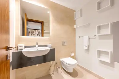 a bathroom with a sink and a toilet at Exclusive Marina Stay - Posh 3BR with Stunning Views in Dubai