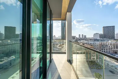 a balcony in a building with a view of a city at Savis Home - Enjoy the City Skyline View 1BR in Binghatti Venus JVC in Dubai