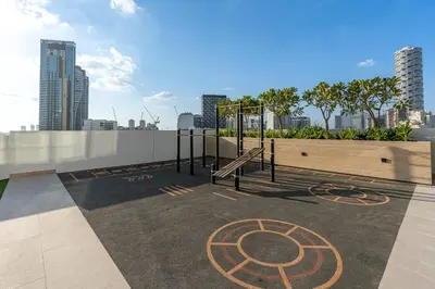 a playground on the roof of a building at Savis Home - Enjoy the City Skyline View 1BR in Binghatti Venus JVC in Dubai