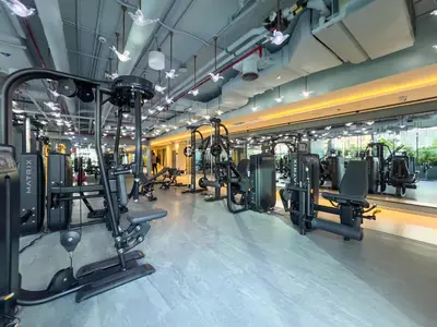 a gym with rows of treadmills and machines at Chic 2BR near Dubai Mall & Burj l Canal & City view I 5 pax in Dubai
