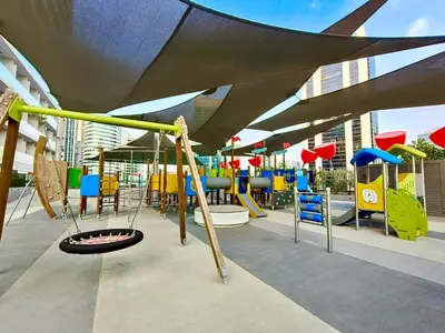 a playground with colorful playground equipment in a building at Chic 2BR near Dubai Mall & Burj l Canal & City view I 5 pax in Dubai