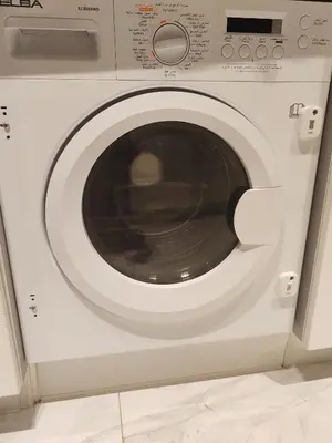 a white washing machine with its door open at Chic 2BR near Dubai Mall & Burj l Canal & City view I 5 pax in Dubai