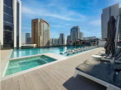 a swimming pool on the roof of a building at Chic 2BR near Dubai Mall & Burj l Canal & City view I 5 pax in Dubai