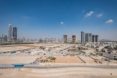 an aerial view of a beach with tall buildings at Cozy Studio in Azizi Riviera 3, Al Merkadh by Deluxe Holiday Homes in Dubai