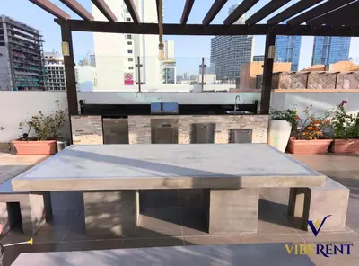a large concrete picnic table on top of a building at La Riviera Serenity in Dubai