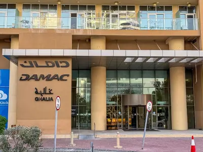 a building with two no parking signs in front of it at Urban Sanctuary Studio with Pool, Gym and Playground in Dubai