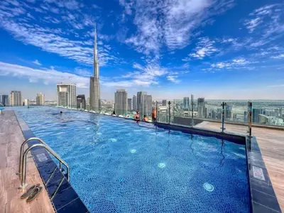 a large swimming pool on the roof of a building at Stunning Burj Khalifa View 5 Star Hotel Amenities in Dubai