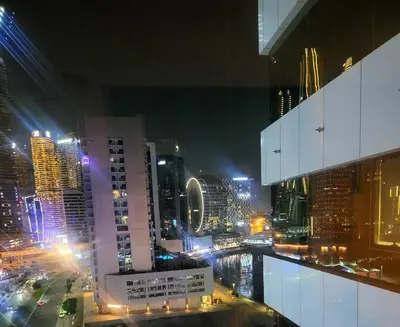 a view of a city at night with buildings at damac maison canal view Luxuary 1BHK in heart downtow in Dubai
