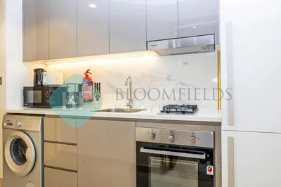 a kitchen with a sink and a dishwasher at Bloomfields Modern Stu In Azizi Riviera in Dubai