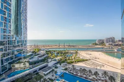 a view of a beach and buildings and the ocean at Al Bateen Residences, JBR- Stunning 2-BR Apartment with Sea View in Dubai