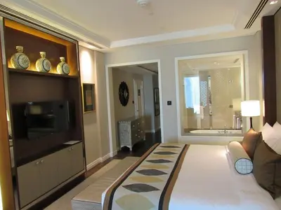 a living room with a couch and a tv at ElevenSisters in Dubai