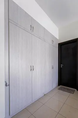 a row of lockers in a room with a door at Luxurious 2BR in Dubai Marina next to metro in Dubai