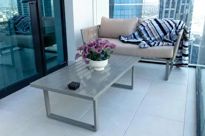 a living room with a coffee table and a couch at Lusso Hometels Missoni Business Bay in Dubai