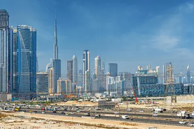 a view of a large city with buildings and traffic at Modern 1br Oasis in Sobha Creek Vista A, MBR City - Allsopp & Allsopp in Dubai