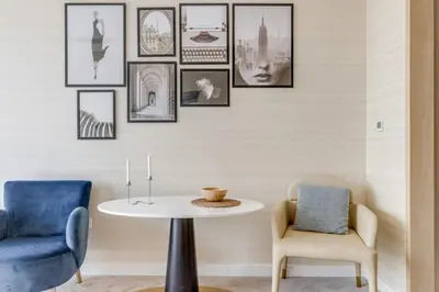 a dining room with a table and two chairs at Luxury Palm Tower Studio Apartments with Pool and Fantastic Sea View in Dubai