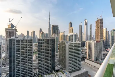 a view of a city skyline with skyscrapers at Amazing 1BR APT with Burj Khalifa Views in Dubai