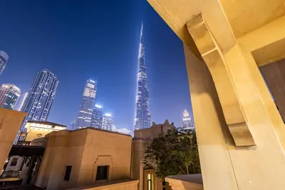 a view of the burj khalifa from a building at Upgraded 1BR Retreat with Iconic Burj Khalifa Views in Dubai