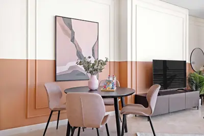 a dining room with a table and chairs and a television at Silkhaus Sky Gardens Chic Studio in DIFC Living in Dubai