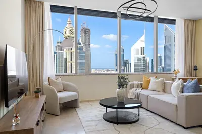 a living room with a couch and a large window at Silkhaus Comfort Studio at Sky gardens-DIFC in Dubai