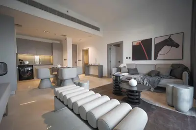 a living room with a couch and a table at Spacious Unit With Burj Khalifa View in Dubai