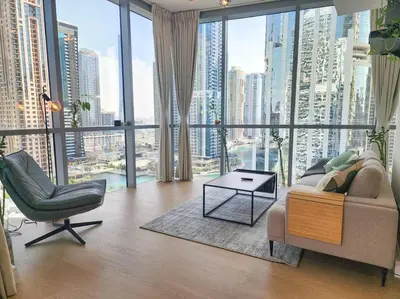 a living room with a large view of a city at Next to METRO 1BED with Panoramic Lake View in Dubai