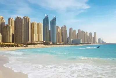 a view of a beach with tall buildings at HAPPY SEASON JBR apartments in Dubai