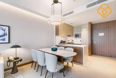 a kitchen and dining room with a table and chairs at Keysplease 2 BR Address Opera walking to Dubai Mall 55 in Dubai