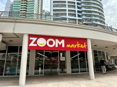 a zon maxet sign on the side of a building at 2BR on 30th Floor in JLT Near Metro & Walking Distance to JBR Beach, Dubai Marina in Dubai