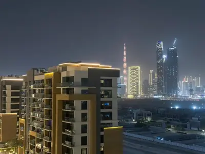 a city skyline at night with tall buildings at Luxury 3BR near to Downtown - Burj Khalifa & Pool Views - 10 min to Dubai Mall in Dubai