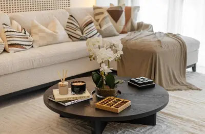 a living room with a coffee table and a couch at Luxury 2BR in Cayan Tower with Sea, Marina & Dubai Eye View in Dubai