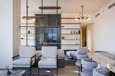 a dining room with chairs and a table at Westminster Forte Burj Khalifa in Dubai