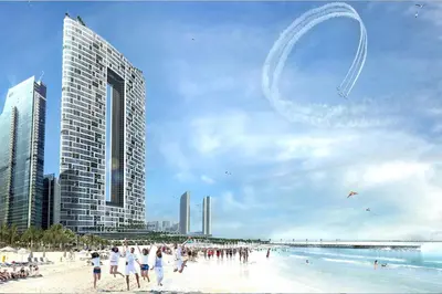 a group of people on a beach with buildings at 1BHK with Marina Views and Beach Access in Dubai