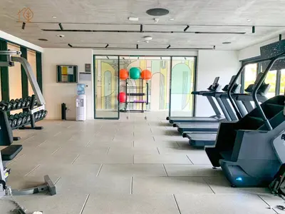 a gym with treadmills and machines in a room at Stylish Apartment with Golf Views in Dubai Hills 199GV-2 in Dubai