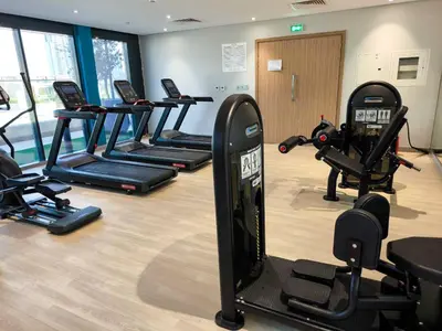 a gym with a bunch of exercise bikes in a room at Burj Khalifa View Pool Gym 10 Min To Downtown in Dubai