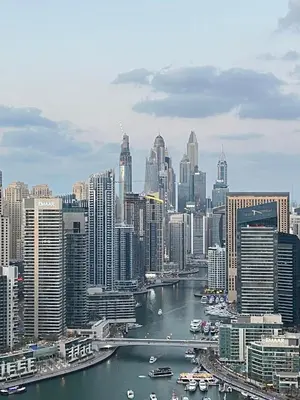 a view of a city with a river and buildings at Dubai Marina stunning views holiday apartment Stella Maris Tower in Dubai
