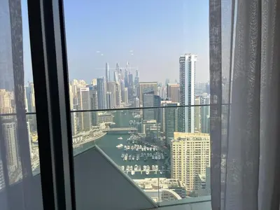 a view of a city from a window in a skyscraper at Dubai Marina stunning views holiday apartment Stella Maris Tower in Dubai