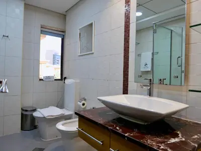 a bathroom with a sink and a toilet at Spacious 4BR Duplex with Terrace - JBR in Dubai