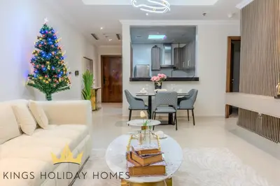a living room with a christmas tree in the middle at Luxury Apartments Dunya tower Burj Khalifa St kings in Dubai