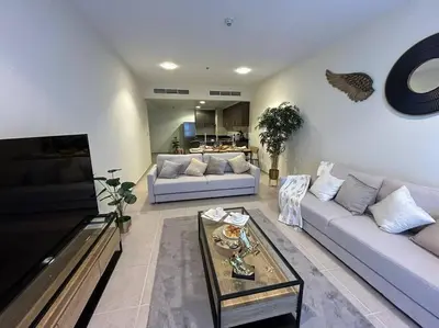 a living room with two couches and a coffee table at 1BHK in Dubai Marina near tram in Dubai