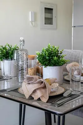 a table with plates and a napkin on it at Frank Porter - Wavez Residence in Dubai