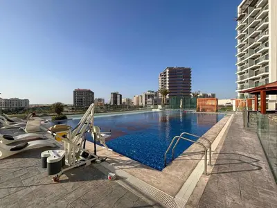 a large swimming pool on top of a building at Frank Porter - Wavez Residence in Dubai