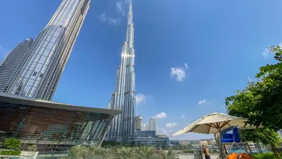 a view of the burj khalifa and the city at Near Burj Khalifa & Dubai Mall - 1BR in Grande Residence, Downtown - Allsopp & Allsopp in Dubai