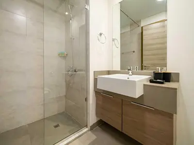 a bathroom with a sink and a shower at Brand New Premium Studio In JVC in Dubai
