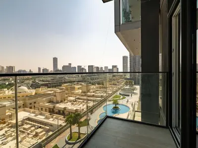 a view of a city from the balcony of a building at Brand New Premium Studio In JVC in Dubai